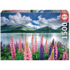 Puzzle Lupins On The Shores of Lake Sils Switzerland Educa 1500 dielov a Fix lepidlo