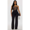 Čipkovaný overal s korzetovým topom v čiernej farbe #Veľkosť XL Farba Čierna