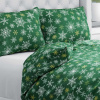 Biante Bavlnené posteľné obliečky Sandra SA-703 Vianočné vločky na zelenom Jednolôžko 140x200 a 70x90 cm