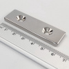 Neodýmový magnet kváder 60×20×4 mm s 2 dierami M4 (severný pól na strane s priehlbinami) - N38