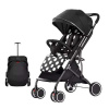 LittleONE Dotti kompaktný športový kočík veľkosti batožiny - Polka dots - black-white Pepita