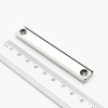 Magnet v puzdre s dierami pre skrutky 80×13,5×5 mm