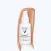 Vichy Capital Soleil UV-Age Daily Anti Photo-Ageing Water Fluid Tinted tónujúce opaľovacie pleťové fluidum SPF50+ 40 ml